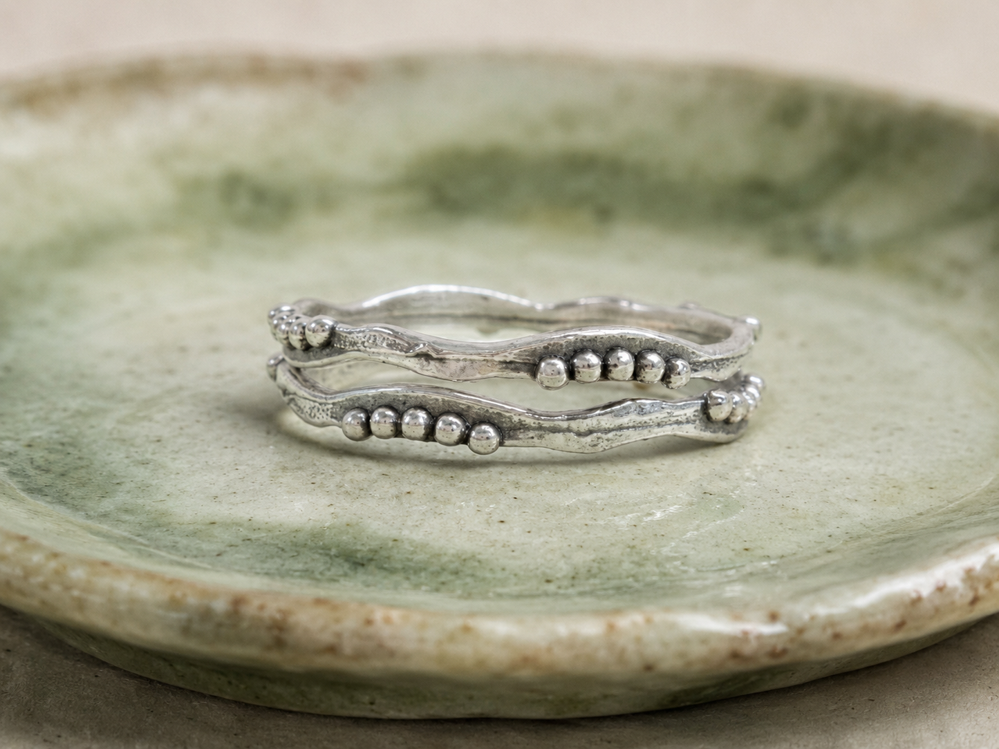 STACK TWO DECORATED SILVER RINGS